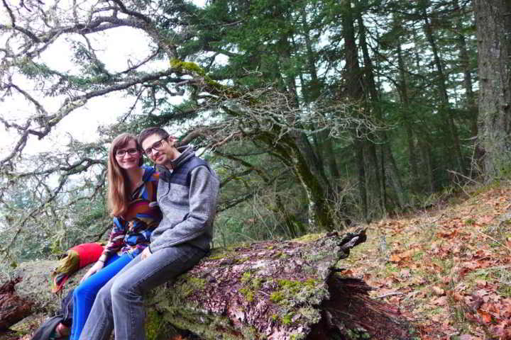 Young Farmers Kailli and Zack take a break from farming on a fallen log