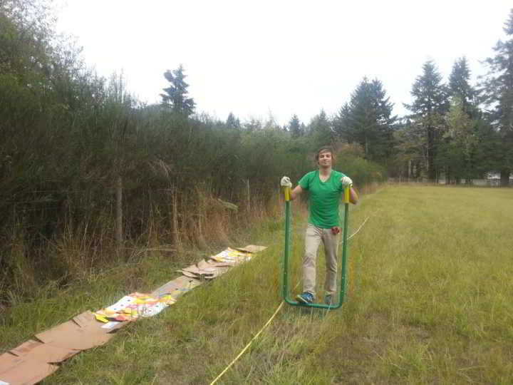 Farmer zach broadforking a new field at Dancing Dandelion Farm