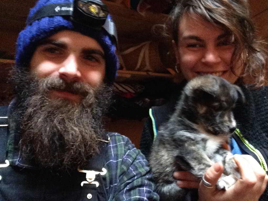 two Young Farmers Leon & Nolwenn holding a farm puppy