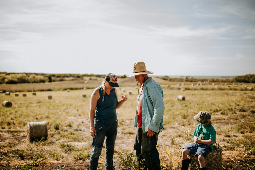rural routs to climate solutions, two farmers in field