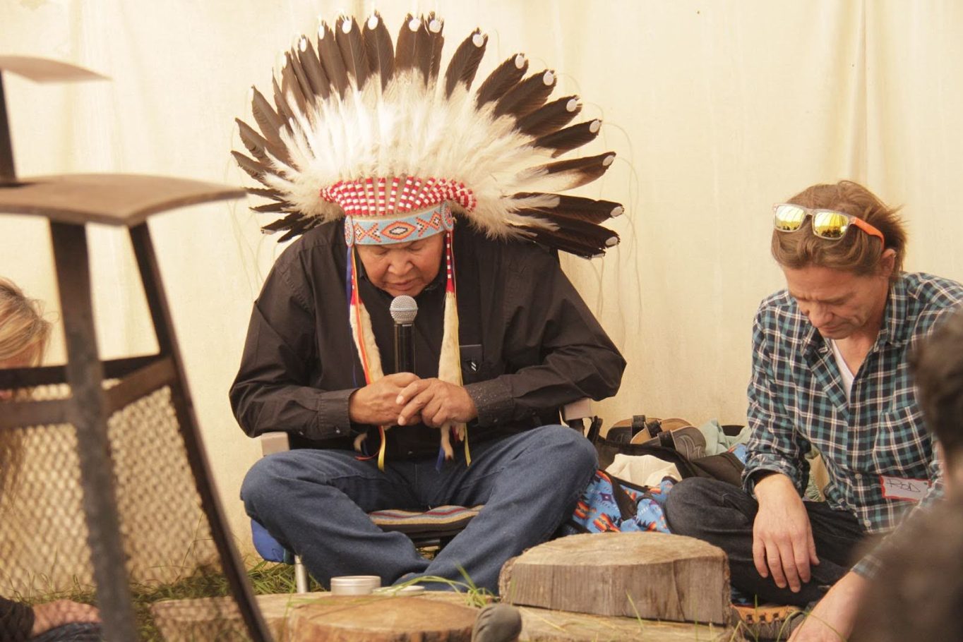 Land of dreams Niitsitapi elder praying with Rod Olsen